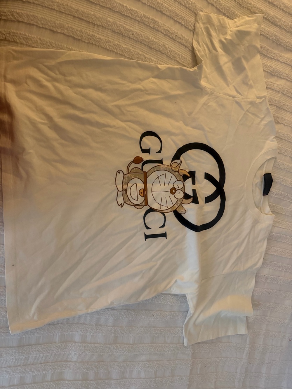 Gucci White Tee with Black Logo and Brown Cartoon Graphic